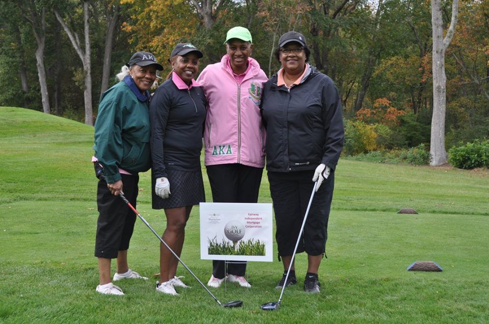 Golfers on the course at the Ivy Golf Classic