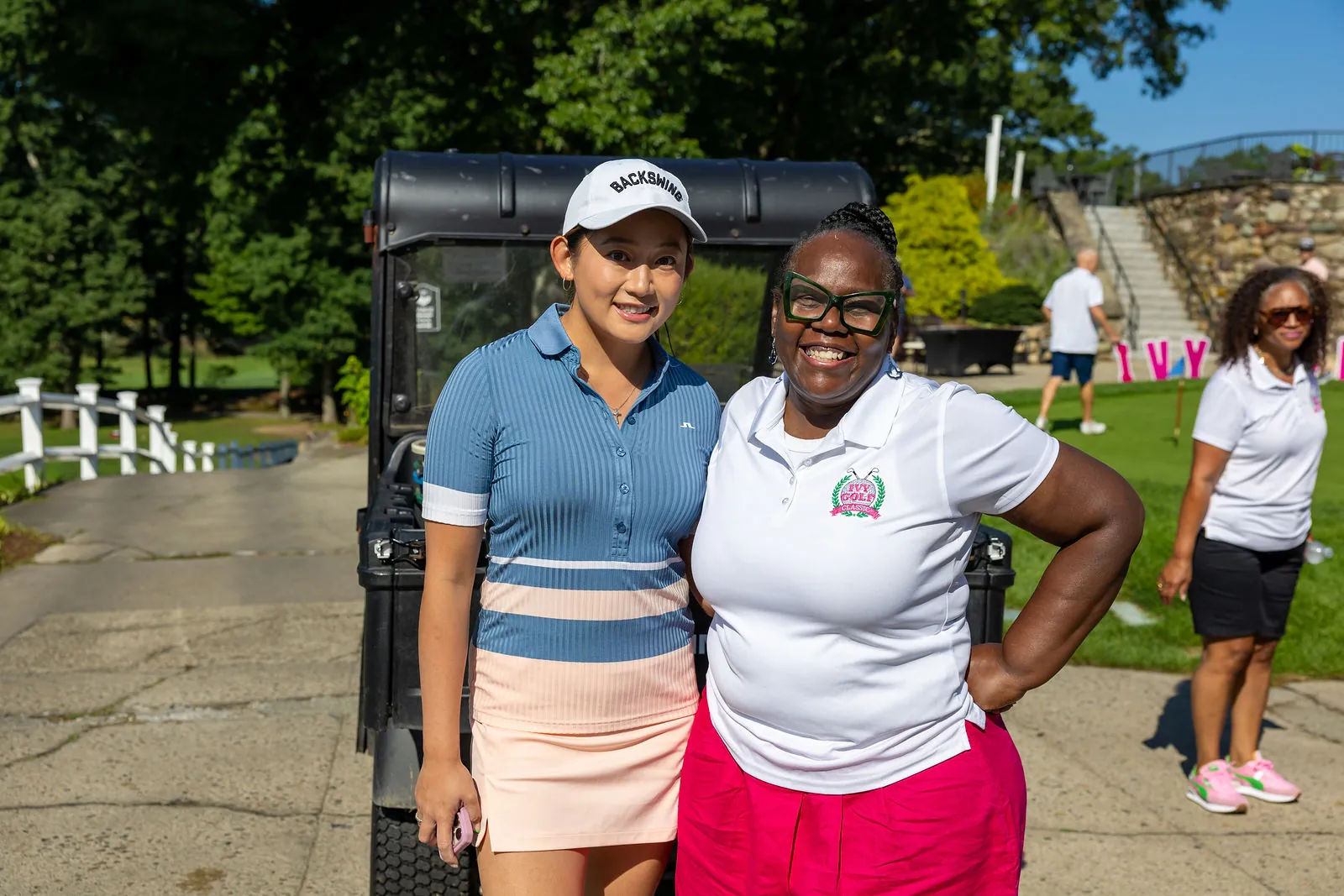 Golfers greet each other before the round