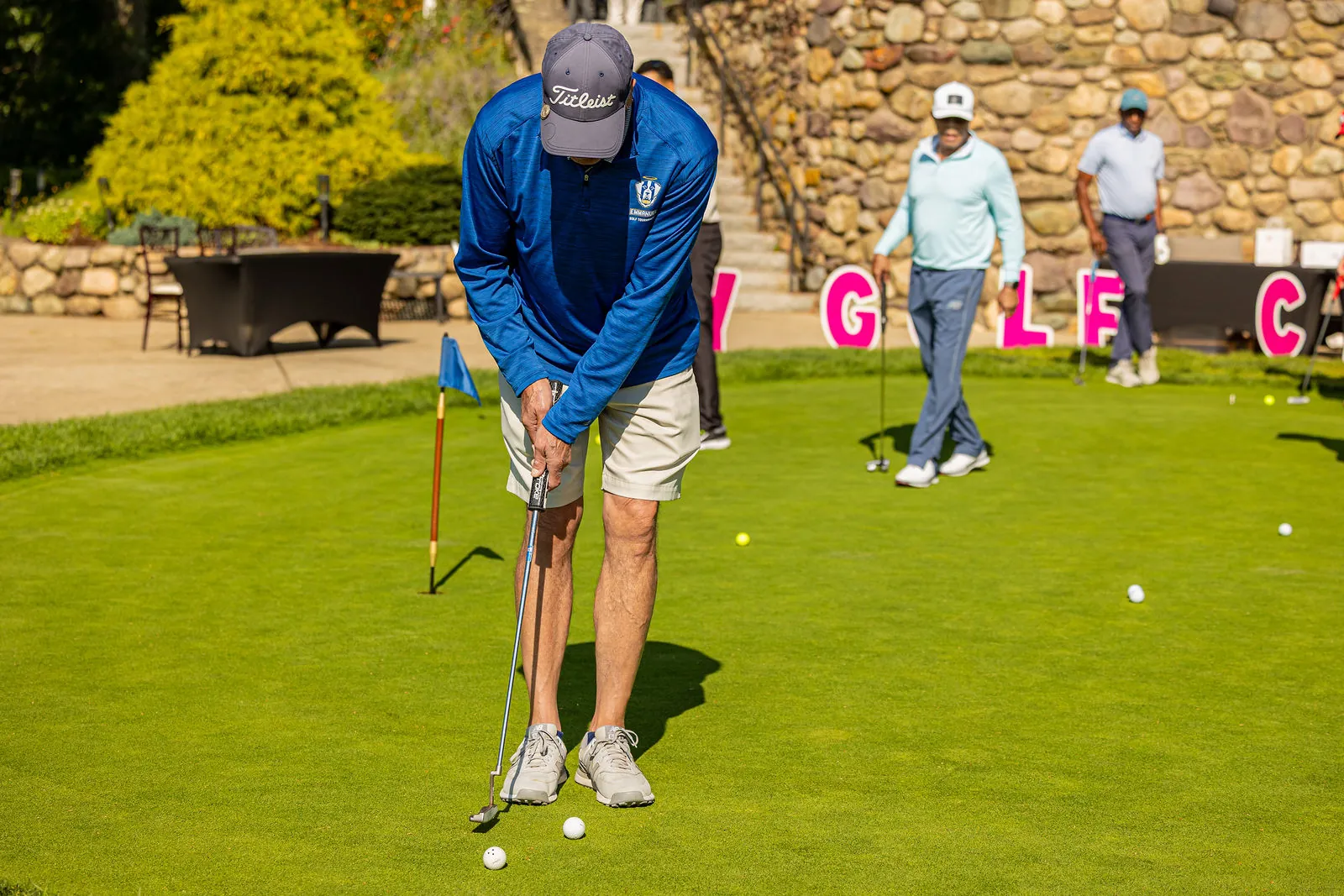 Lining up a putt on the practice green