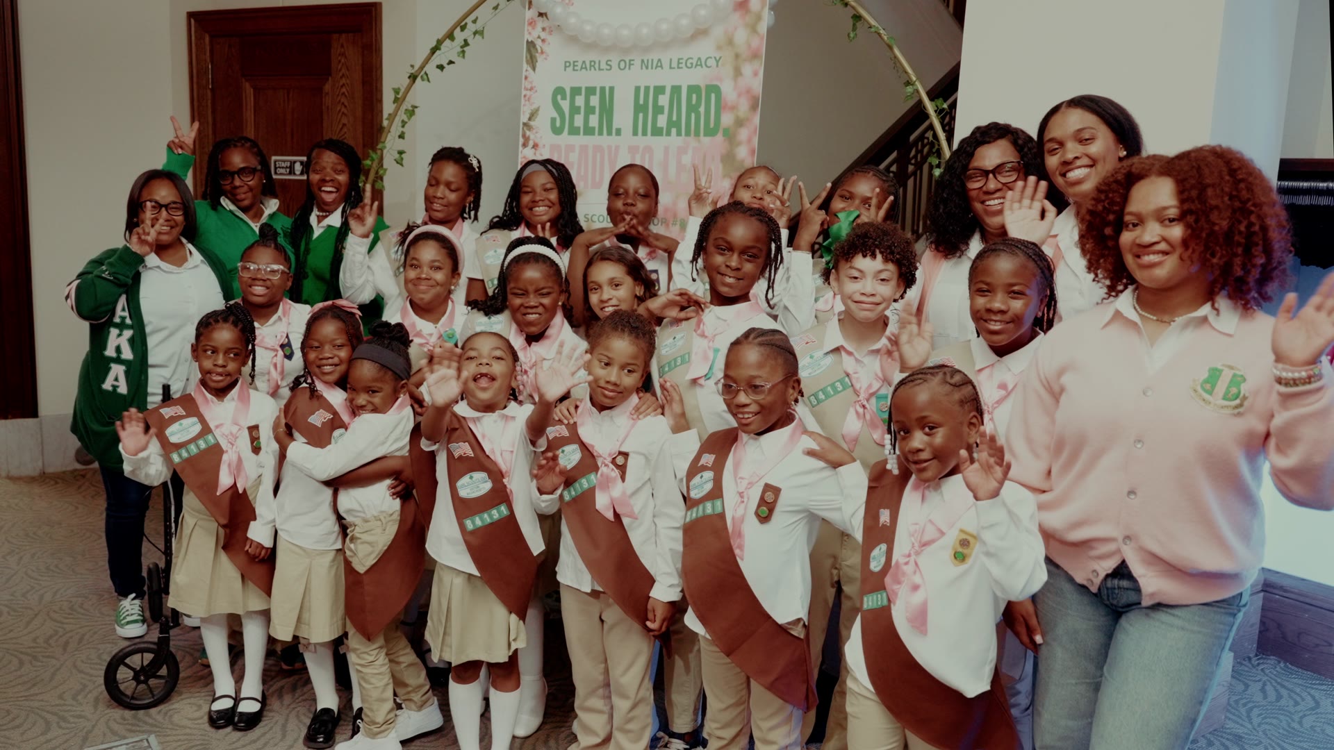 Pearls of Nia Legacy girls and troop leaders celebrating at the inaugural launch and pinning ceremony